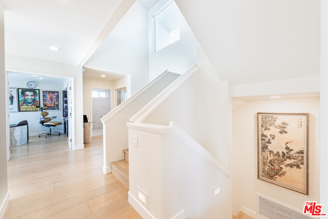 31271 Bailard Road Malibu, CA 90265 - Photo 12 of 38 a view of staircase with furniture and a kitchen