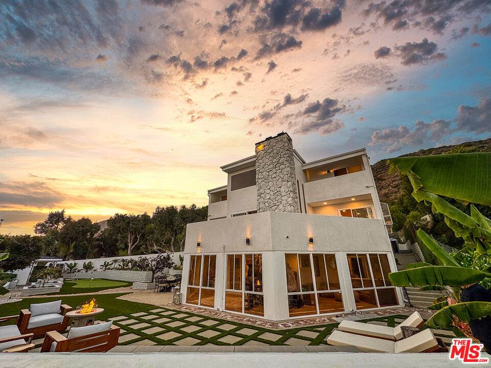 31271 Bailard Road Malibu, CA 90265 - Photo 3 of 38 a view of a swimming pool with lounge chair
