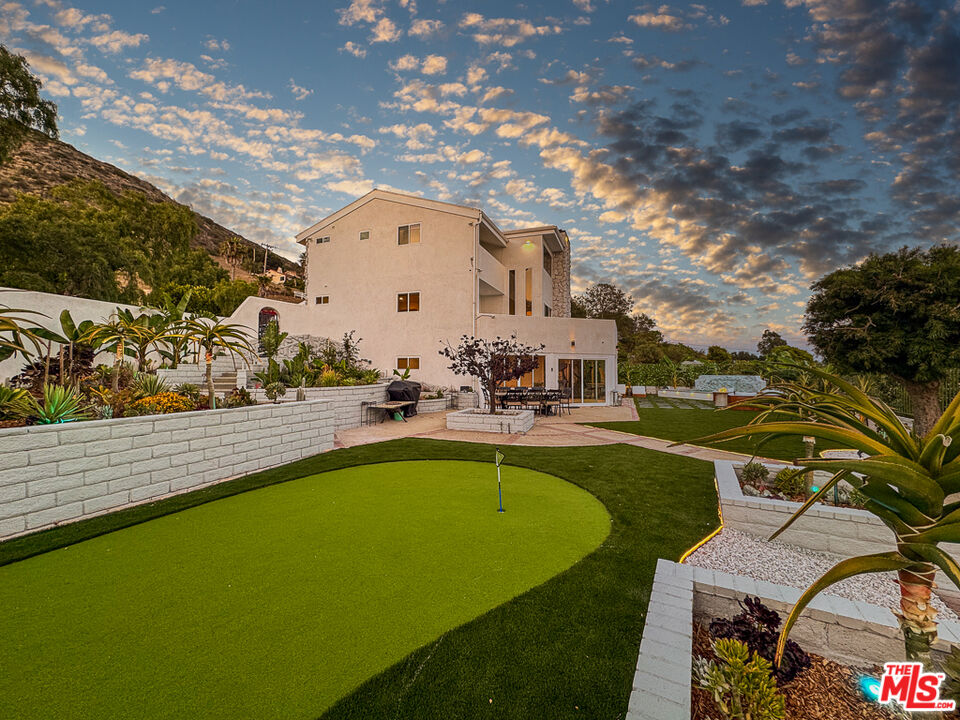 31271 Bailard Road Malibu, CA 90265 - Photo 5 of 38 a view of swimming pool with outdoor seating and plants