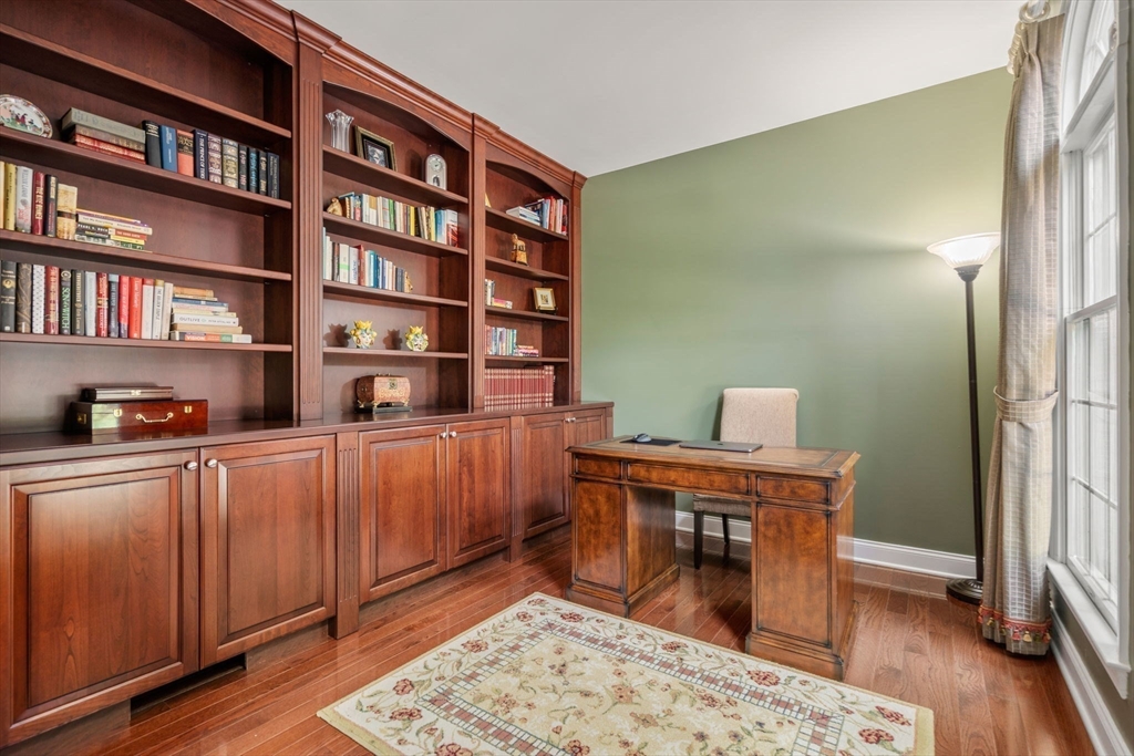 34 Hound Pack Circle Walpole, MA 02032 - Photo 12 of 40 a room with furniture and a book shelf