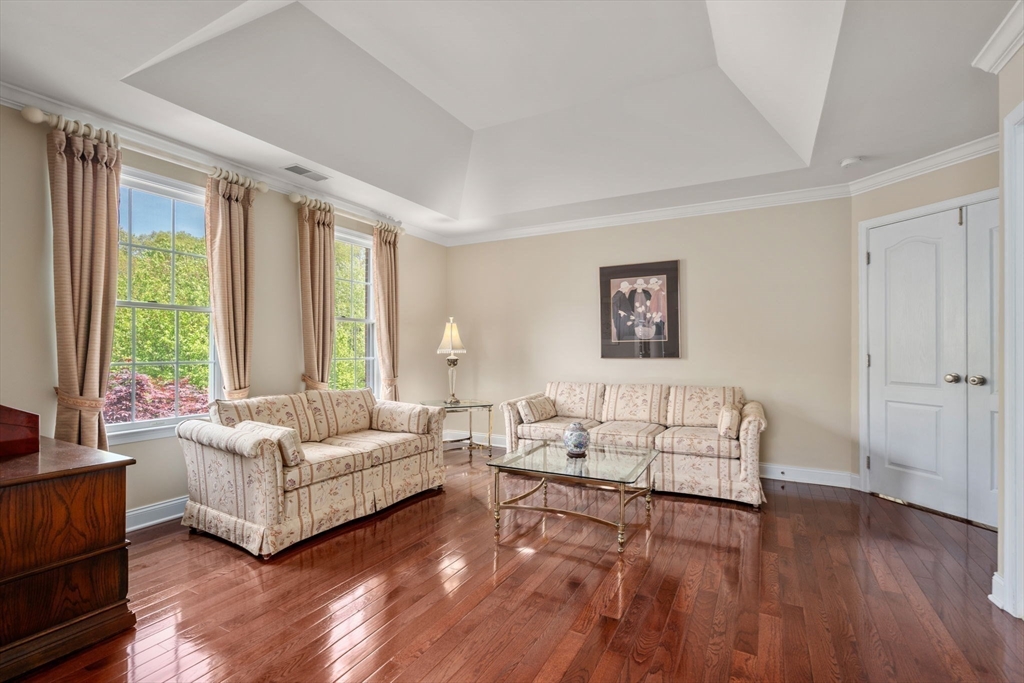 34 Hound Pack Circle Walpole, MA 02032 - Photo 14 of 40 a living room with furniture and a large window