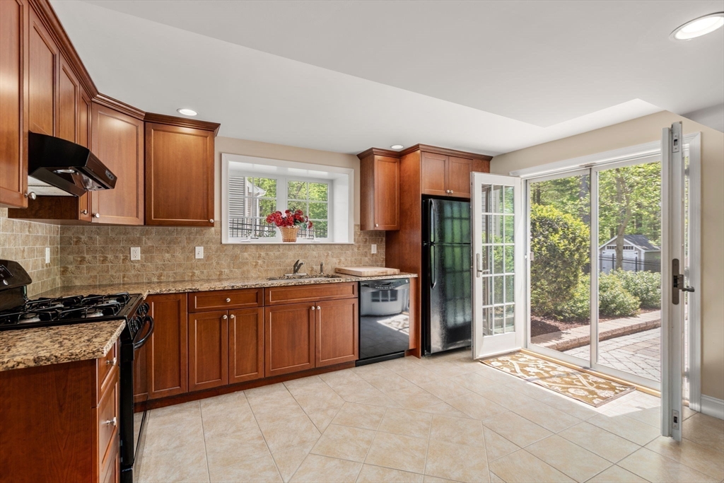 34 Hound Pack Circle Walpole, MA 02032 - Photo 22 of 40 a large kitchen with stainless steel appliances granite countertop a stove a sink and a refrigerator
