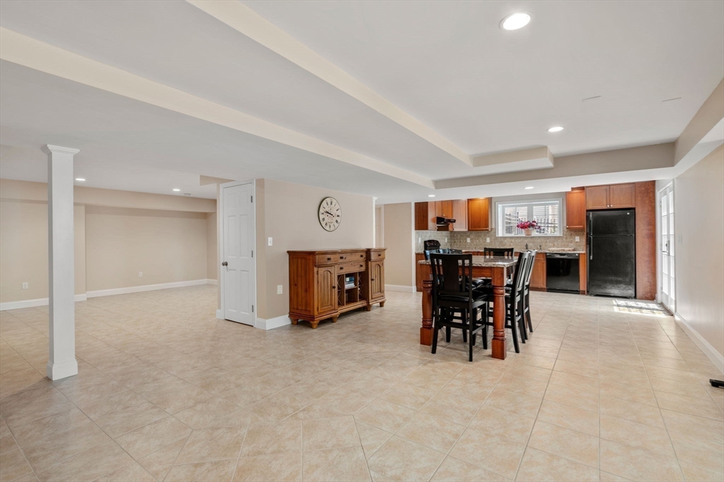 34 Hound Pack Circle Walpole, MA 02032 - Photo 23 of 40 a view of a big room with lounge chair and windows