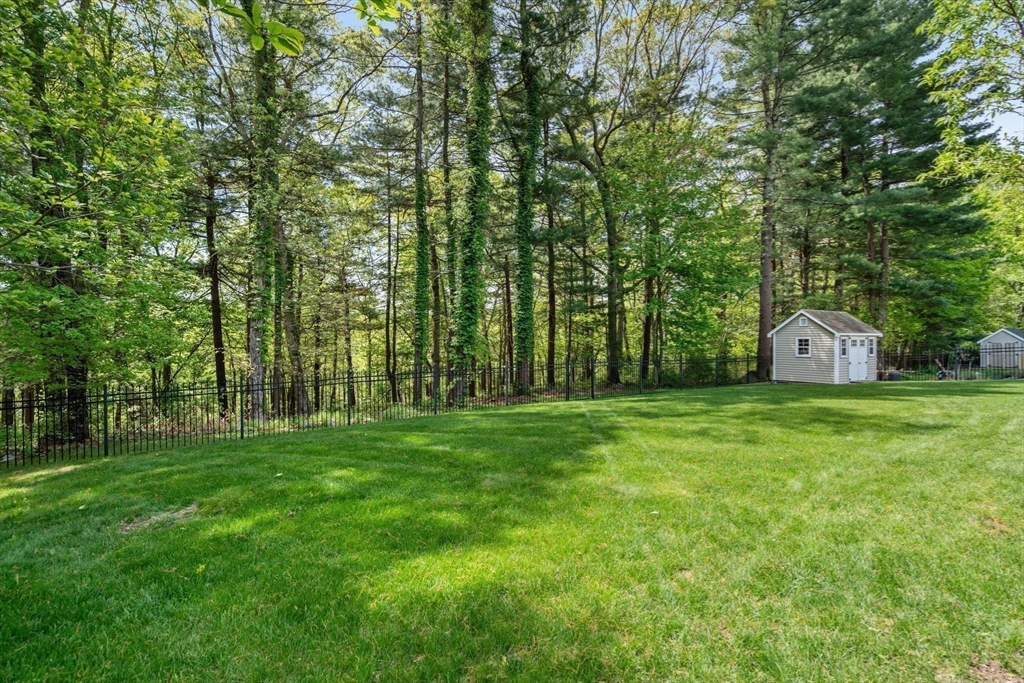 34 Hound Pack Circle Walpole, MA 02032 - Photo 34 of 40 a house view with a garden space