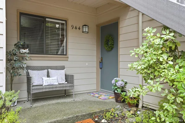 a bench sitting in front of a house