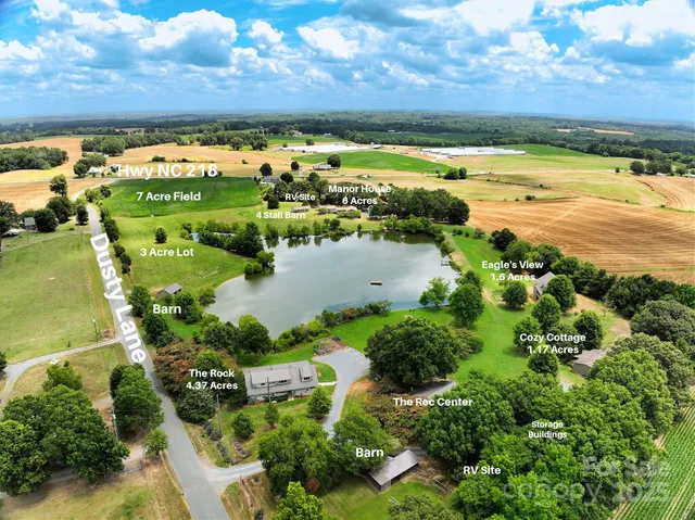 a view of a lake with a yard and mountain view