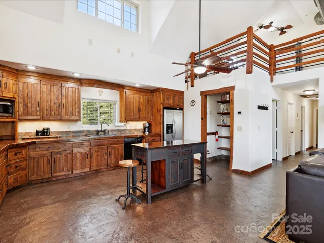 a living room with furniture wooden floor and a chandelier