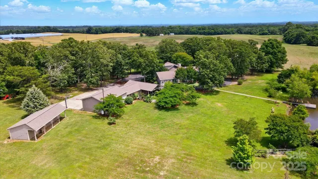 a wooden bench sitting in the middle of a lake