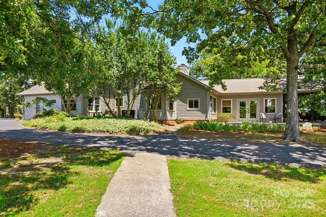 a kitchen with stainless steel appliances granite countertop a stove a refrigerator and a refrigerator