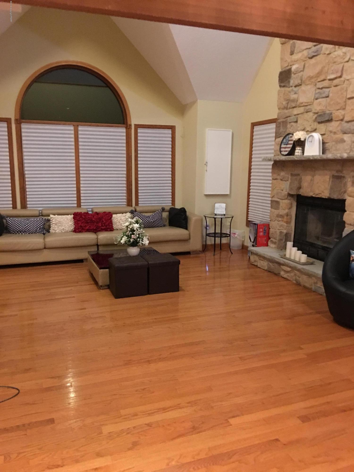 189 Gold Finch Road Bushkill, PA 18324 - Photo 5 of 23 a living room with fireplace furniture and a large window