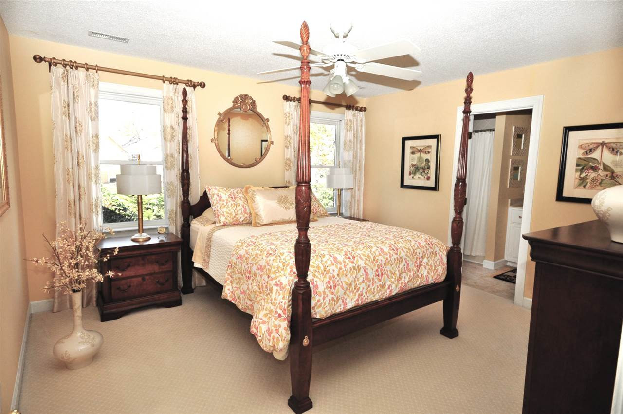 8808 Ross Court Raleigh, NC 27613 - Photo 14 of 25 This bedroom is ample in size, has a walk in closet and its own bath. Secondary bedroom