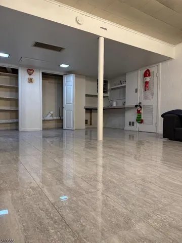 an empty room with shelves