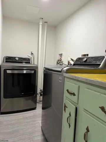 a stove top oven sitting inside of a kitchen