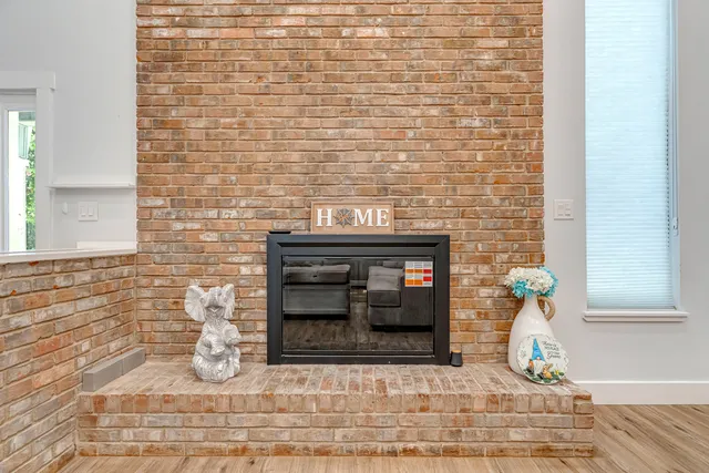 a kitchen with stainless steel appliances granite countertop a sink and a refrigerator