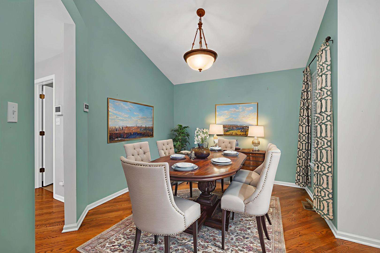1211 Bluejay Lane Plainfield, IL 60586 - Photo 15 of 32 a dining room with furniture a rug and wooden floor