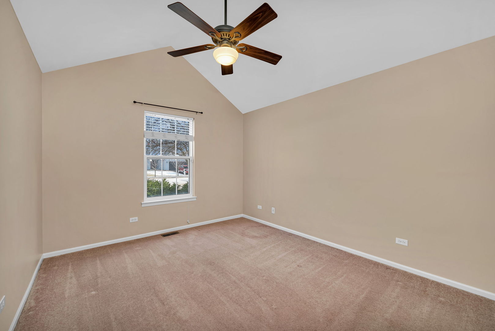 1211 Bluejay Lane Plainfield, IL 60586 - Photo 22 of 32 an empty room with a window and a fan