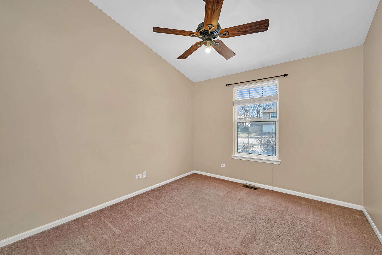 1211 Bluejay Lane Plainfield, IL 60586 - Photo 24 of 32 an empty room with a window and a fan