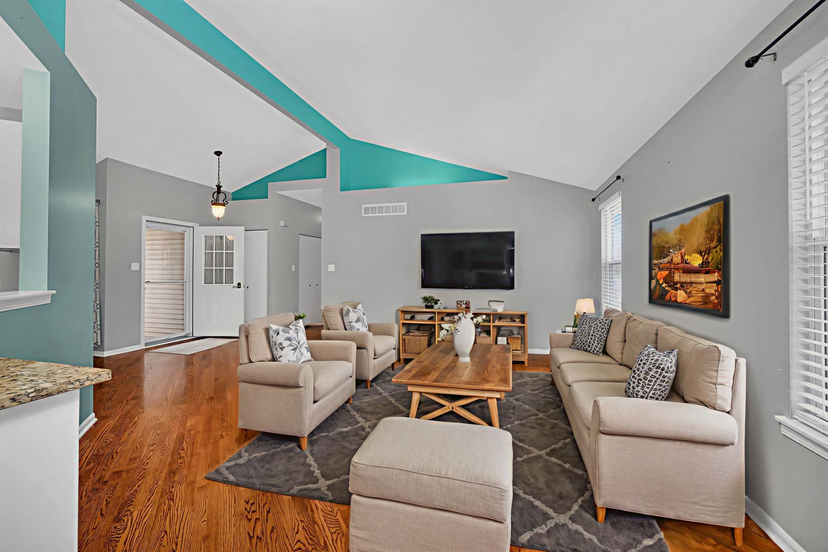 1211 Bluejay Lane Plainfield, IL 60586 - Photo 7 of 32 a living room with furniture and a flat screen tv