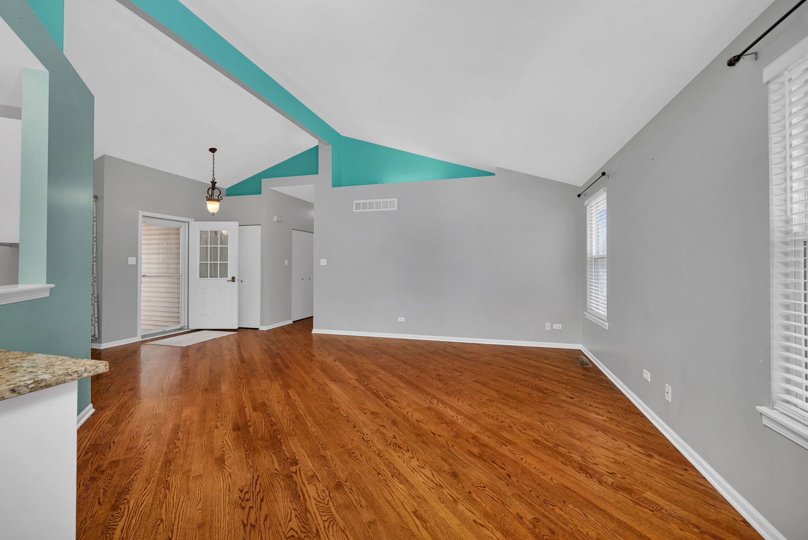 1211 Bluejay Lane Plainfield, IL 60586 - Photo 8 of 32 a view of an empty room with wooden floor and a window
