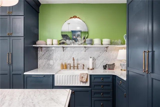 a kitchen with a sink cabinets and a refrigerator