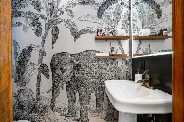 a bathroom with a sink and mirror