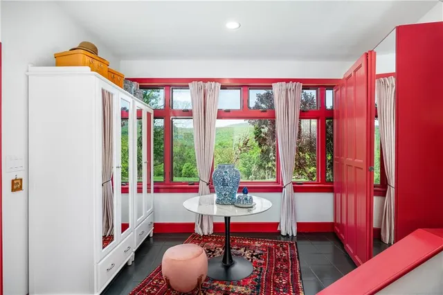 a living room with lots of furniture and a clock