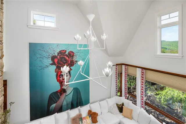 a view of a living room and a painting on the wall