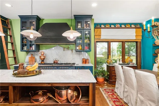 a kitchen with a table and chairs in it
