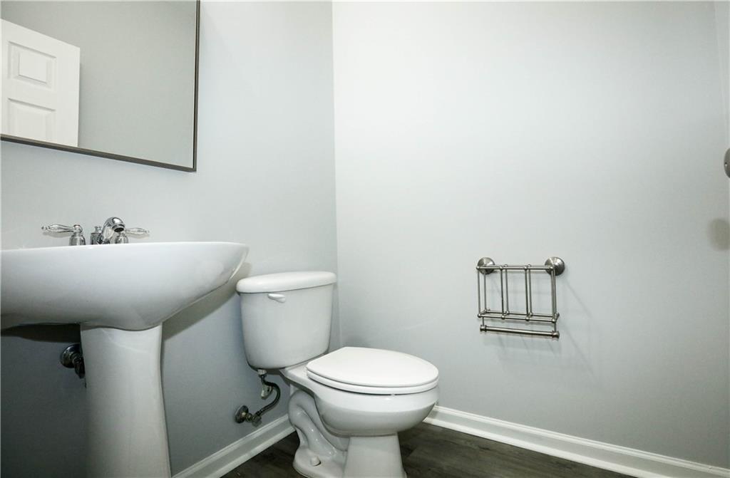 2410 Sardis Chase Court Buford, GA 30519 - Photo 15 of 35 a bathroom with a sink mirror and toilet