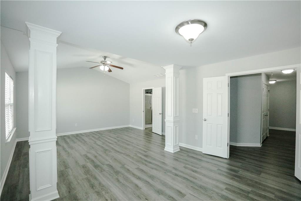 2410 Sardis Chase Court Buford, GA 30519 - Photo 17 of 35 a view of an empty room with wooden floor