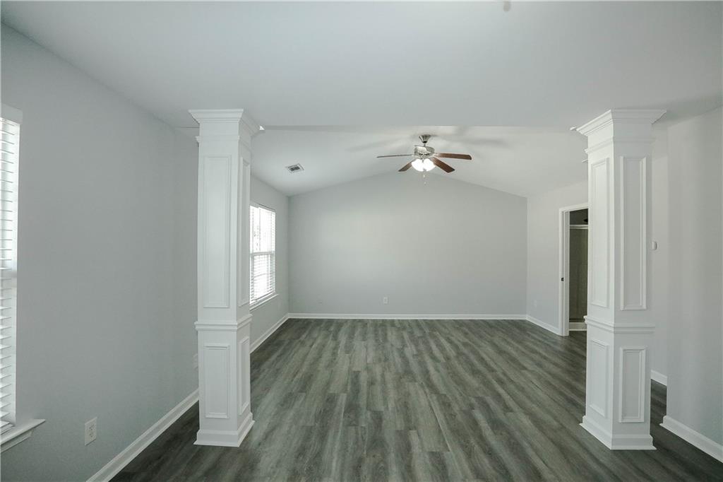 2410 Sardis Chase Court Buford, GA 30519 - Photo 18 of 35 wooden floor in an empty room with a window