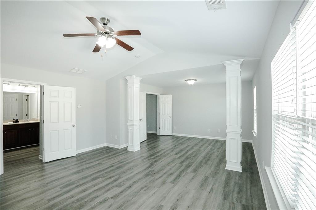 2410 Sardis Chase Court Buford, GA 30519 - Photo 19 of 35 wooden floor in an empty room with a window