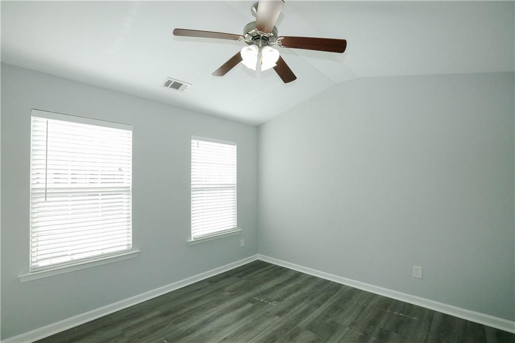 2410 Sardis Chase Court Buford, GA 30519 - Photo 26 of 35 wooden floor in an empty room with a window