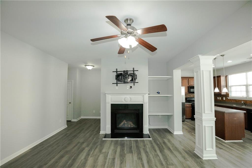 2410 Sardis Chase Court Buford, GA 30519 - Photo 3 of 35 a living room with furniture and a fireplace