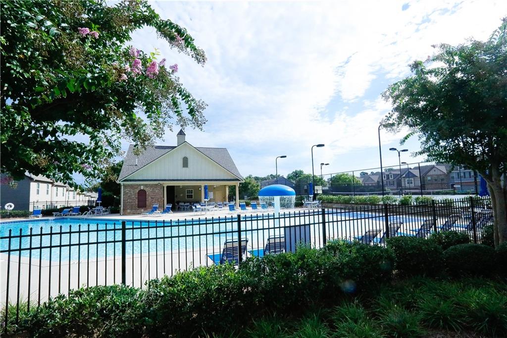 2410 Sardis Chase Court Buford, GA 30519 - Photo 31 of 35 a view of a house with a small yard and sitting area