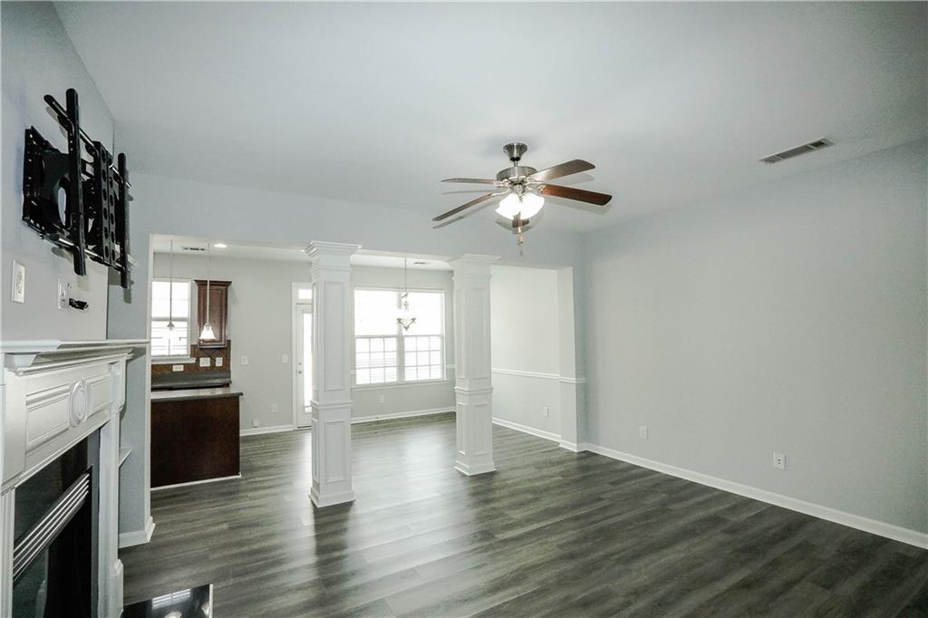 2410 Sardis Chase Court Buford, GA 30519 - Photo 6 of 35 a view of a kitchen with stove and wooden floor