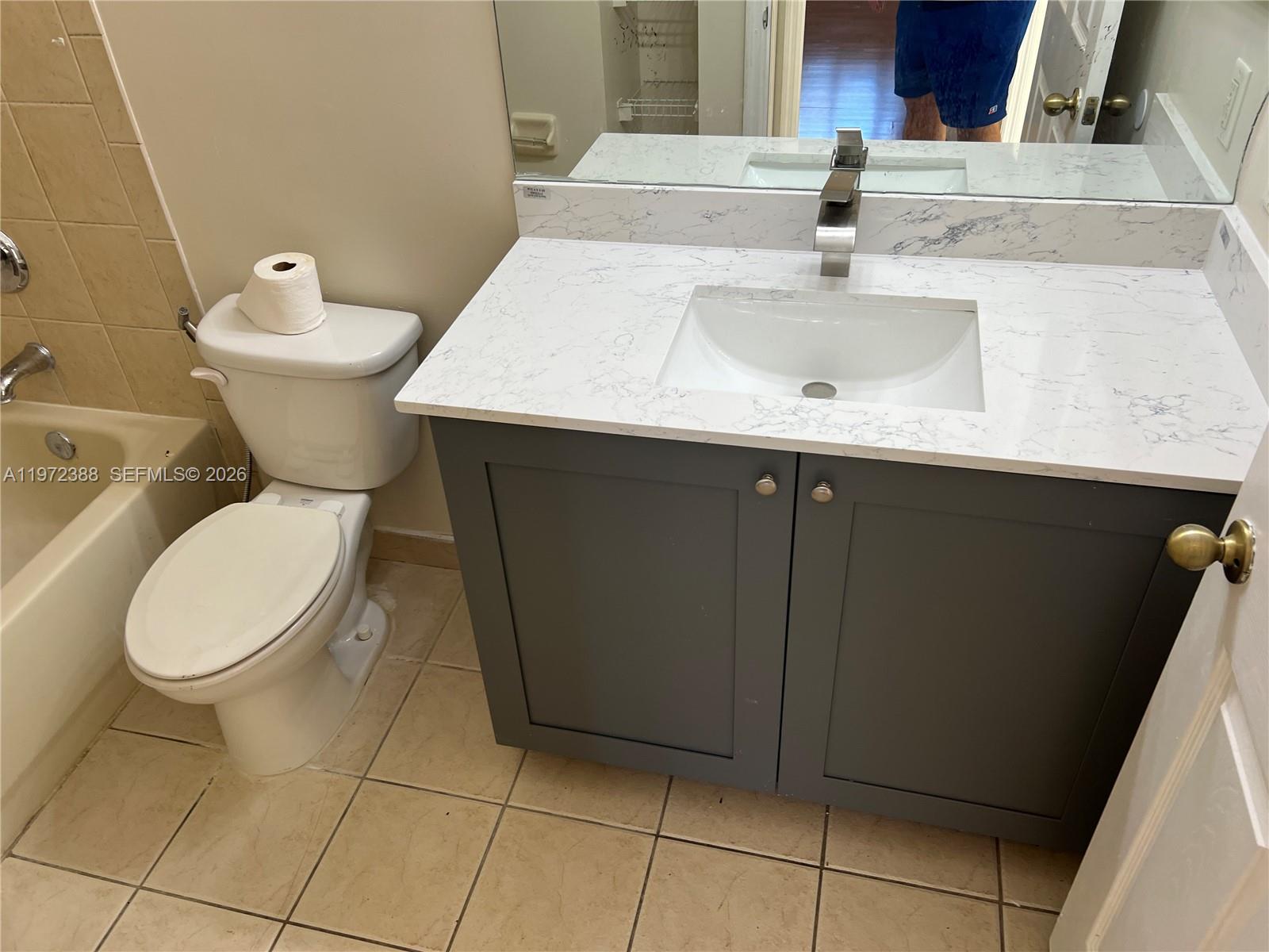 100 Southwest 15th Avenue Homestead, FL 33030 - Photo 19 of 62 a white toilet sitting next to a bathroom sink
