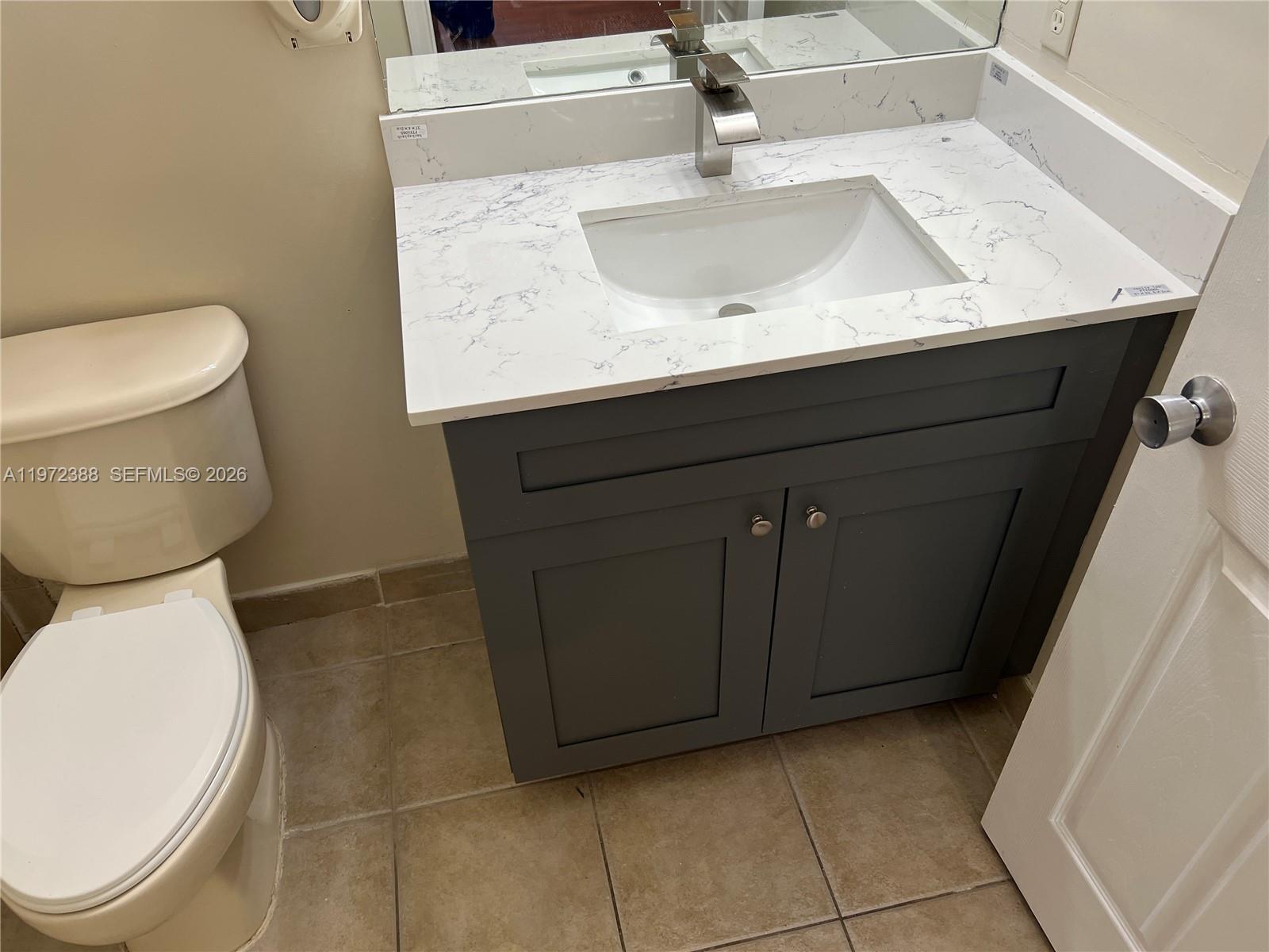 100 Southwest 15th Avenue Homestead, FL 33030 - Photo 35 of 62 a bathroom with a sink and a toilet