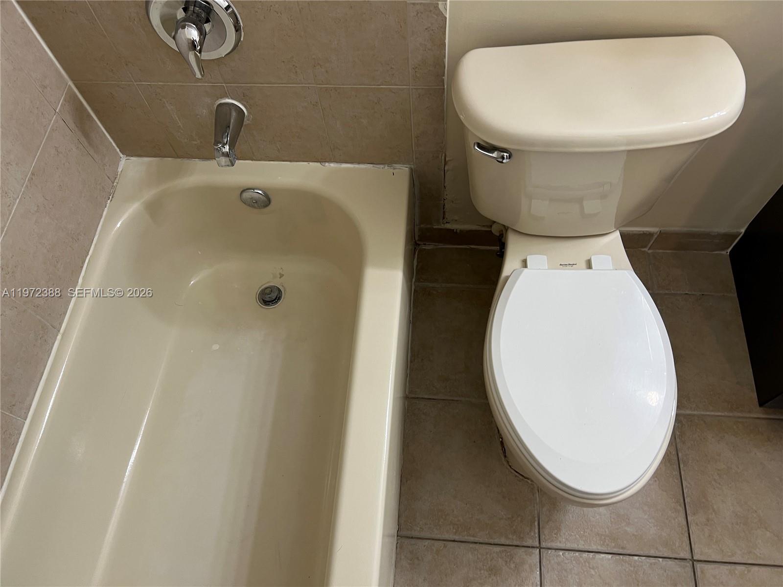 100 Southwest 15th Avenue Homestead, FL 33030 - Photo 37 of 62 a bathroom with a toilet and a sink