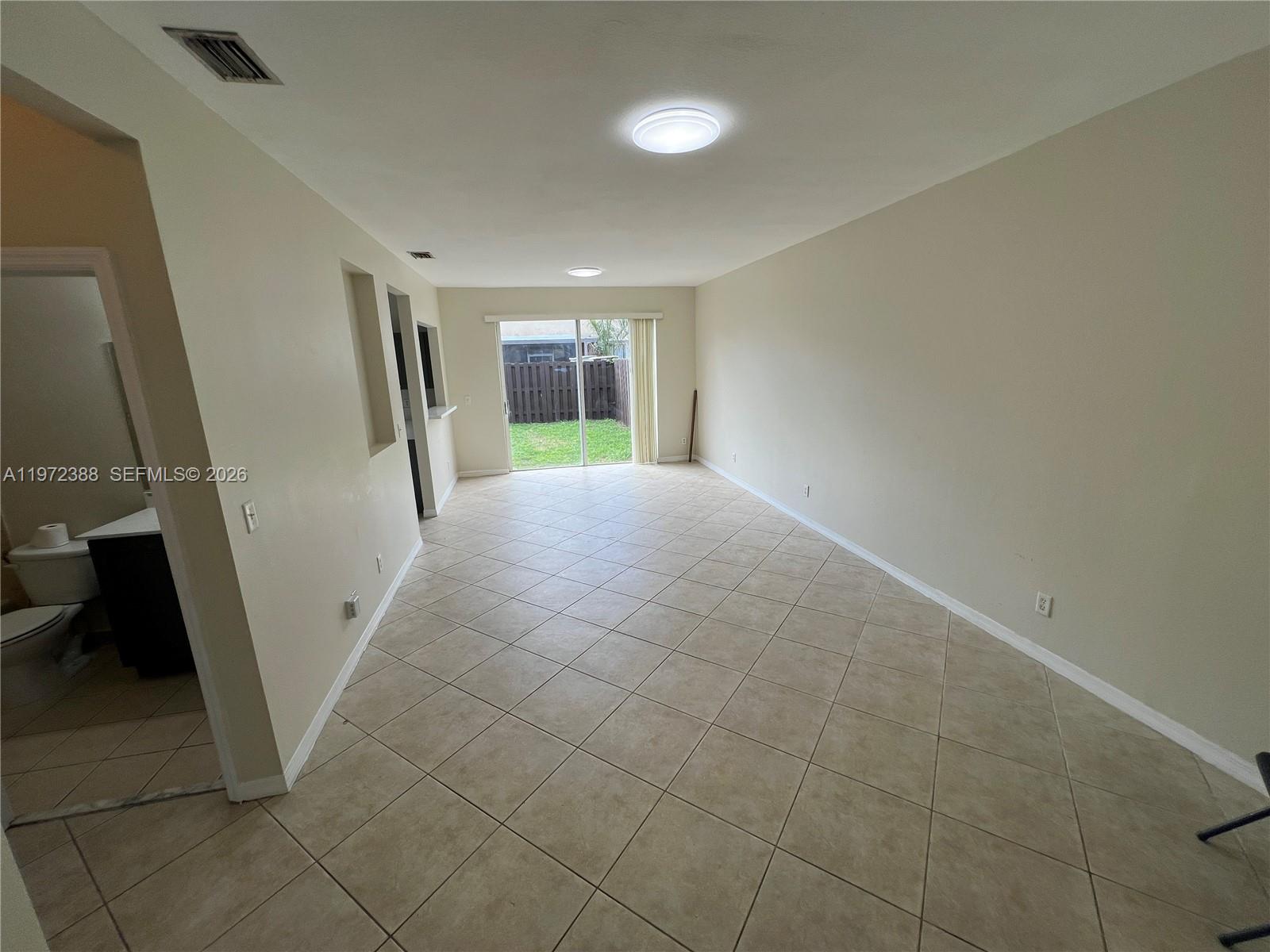 100 Southwest 15th Avenue Homestead, FL 33030 - Photo 4 of 62 en empty room with windows