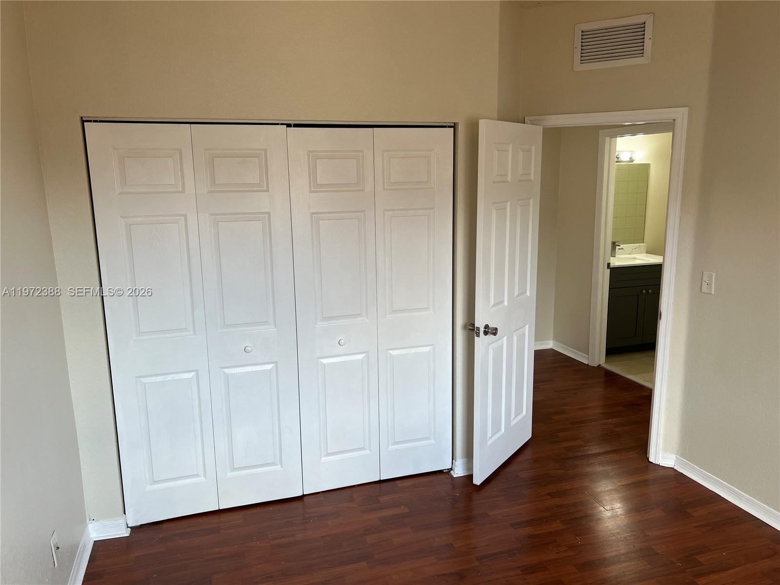 100 Southwest 15th Avenue Homestead, FL 33030 - Photo 44 of 62 a view of an empty room with wooden floor