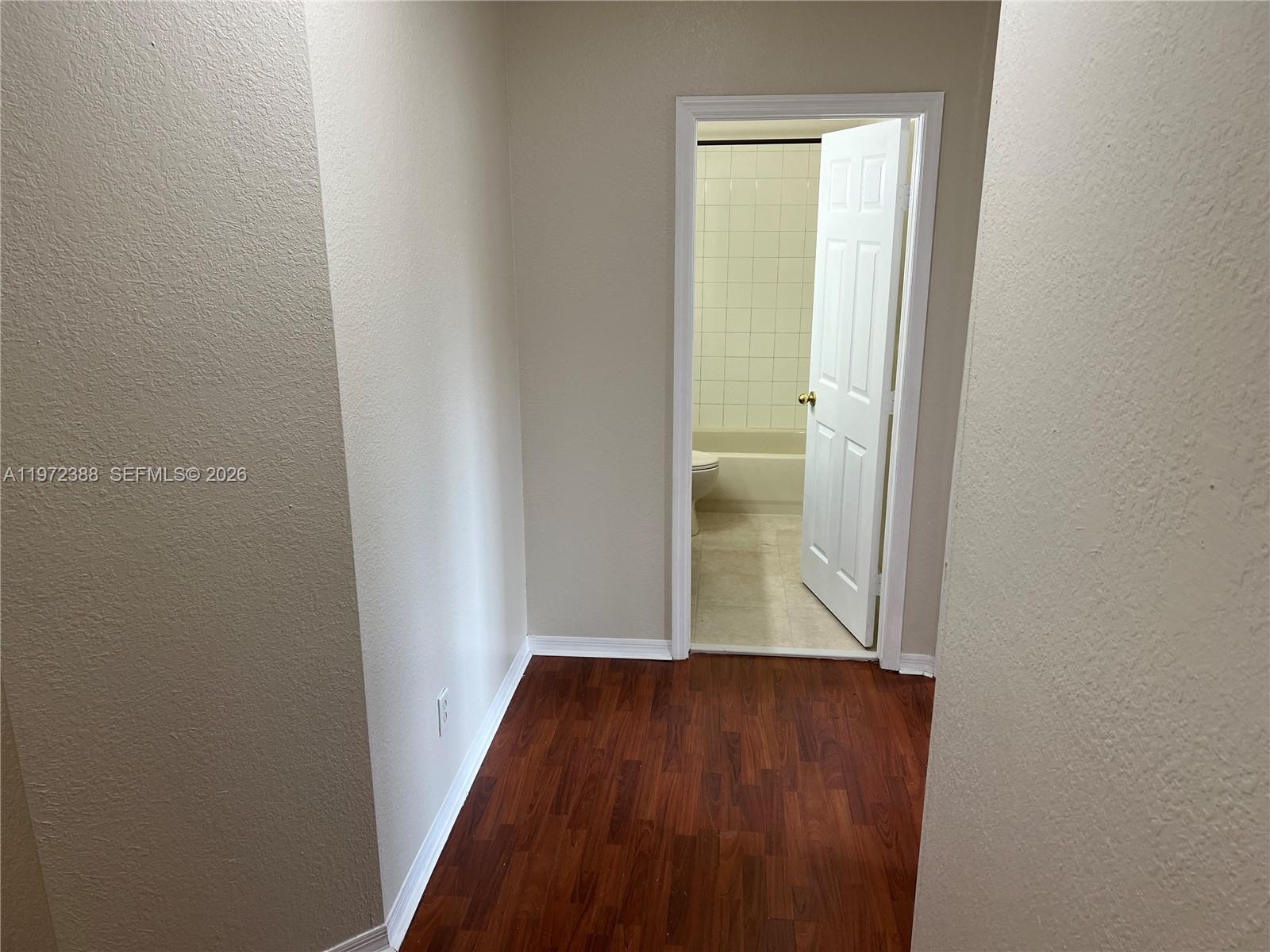 100 Southwest 15th Avenue Homestead, FL 33030 - Photo 47 of 62 a view of a hallway with wooden floor