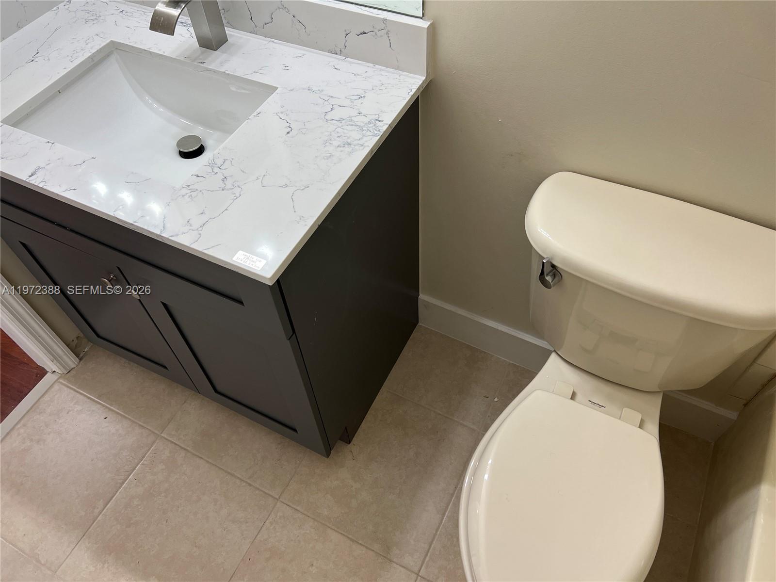 100 Southwest 15th Avenue Homestead, FL 33030 - Photo 49 of 62 a bathroom with a sink toilet and mirror