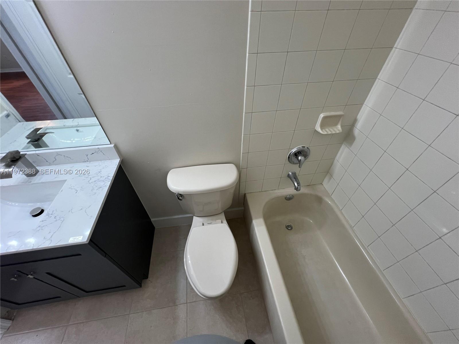 100 Southwest 15th Avenue Homestead, FL 33030 - Photo 50 of 62 a bathroom with a toilet and a sink