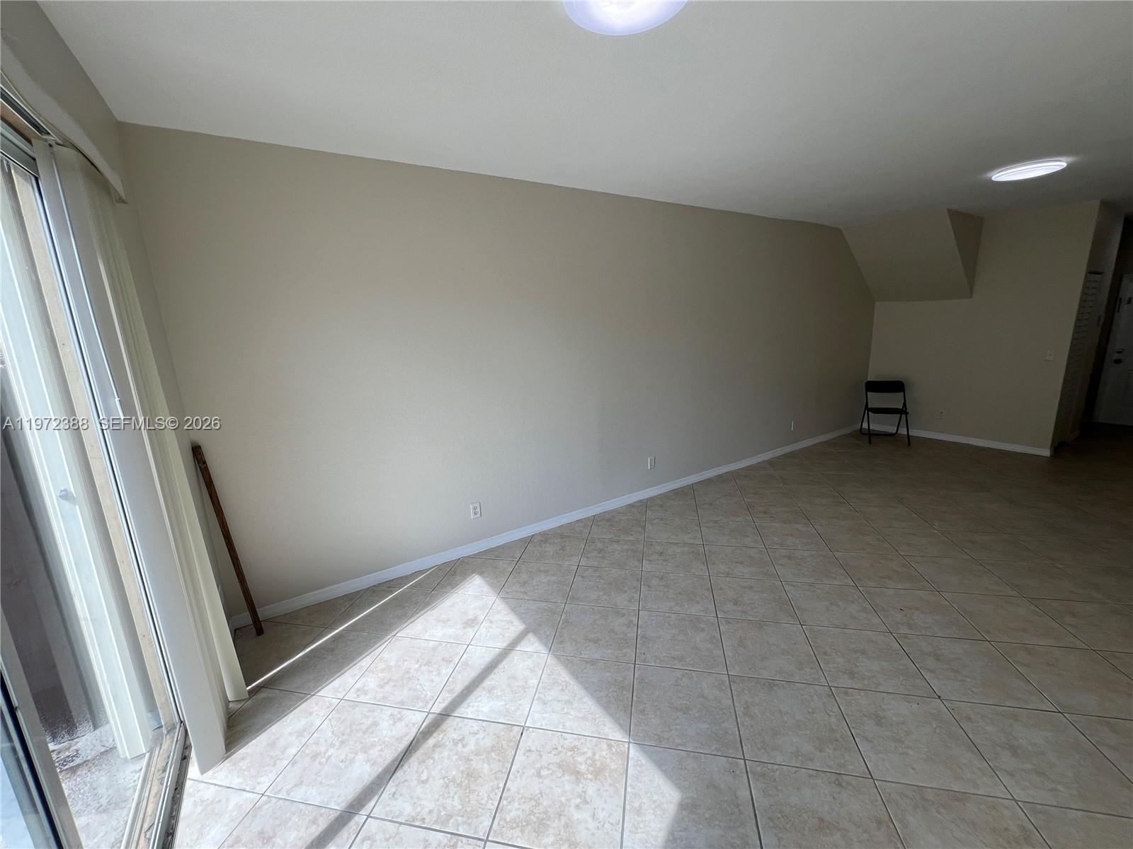 100 Southwest 15th Avenue Homestead, FL 33030 - Photo 9 of 62 a view of an empty room and a window