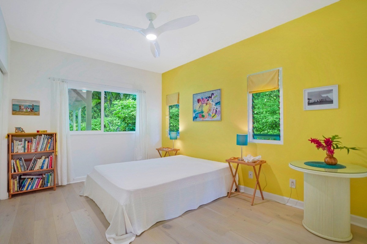 6431 Poo Road, Unit 2 Kapaa, HI 96746 - Photo 13 of 30 a bedroom with a bed and a table