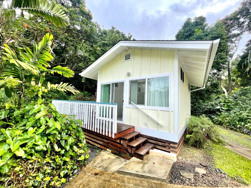 6431 Poo Road, Unit 2 Kapaa, HI 96746 - Photo 27 of 30 a view of a house with a small yard and wooden floor