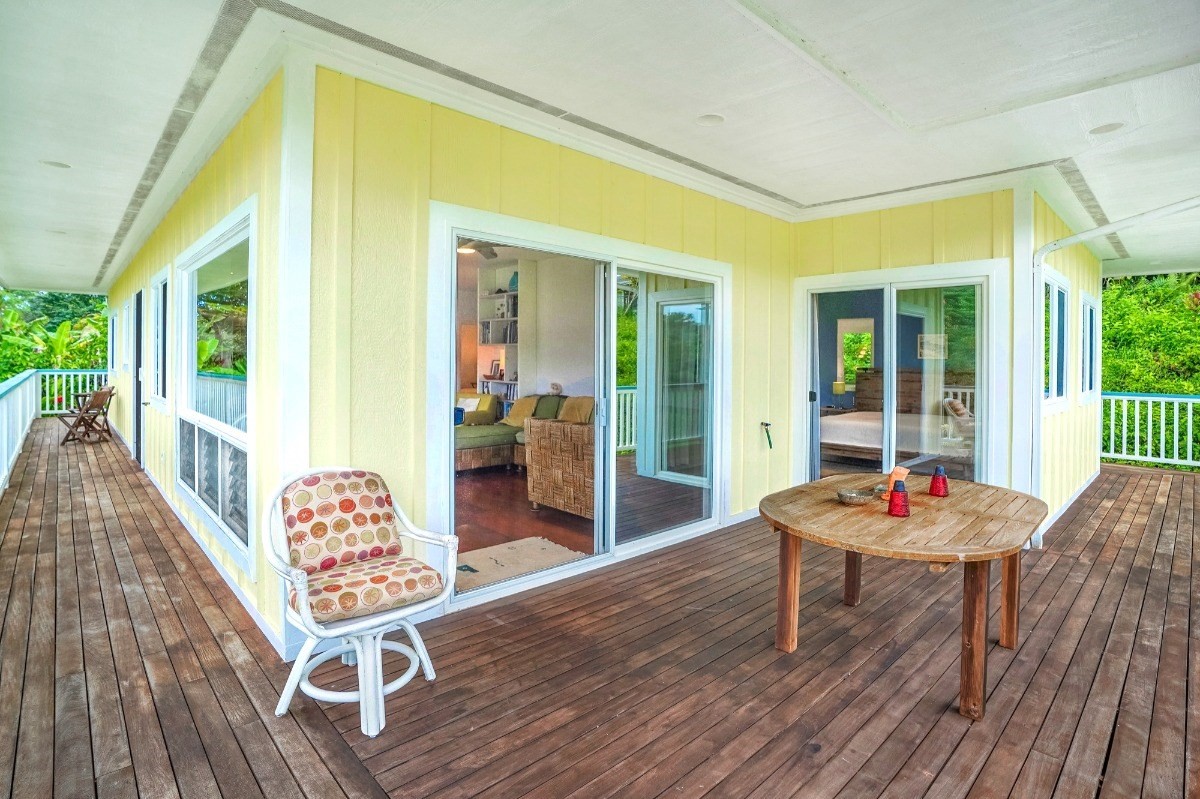 6431 Poo Road, Unit 2 Kapaa, HI 96746 - Photo 7 of 30 a outdoor space with patio the couches and a dining table with garden view