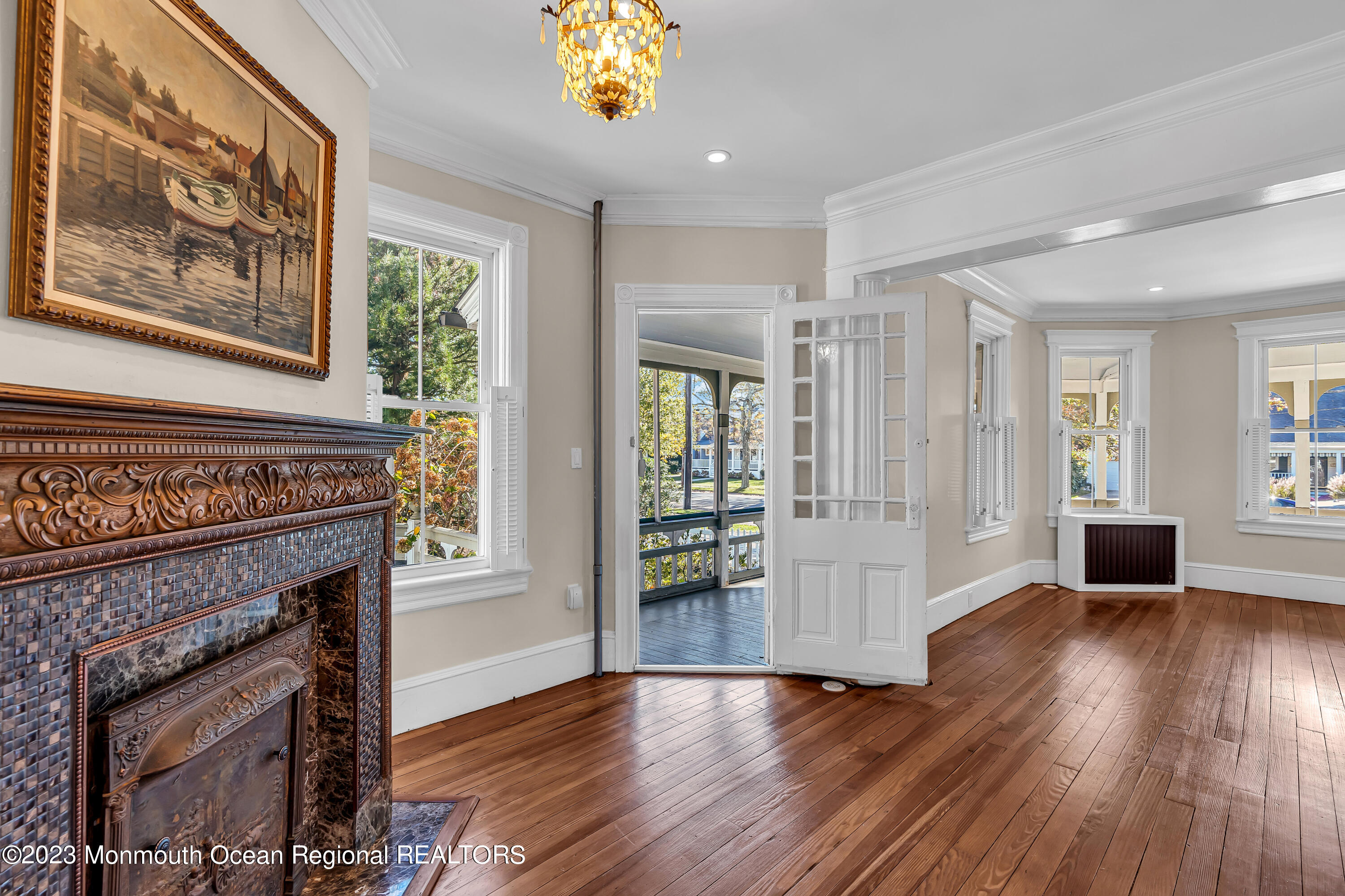 424 Mercer Avenue Spring Lake, NJ 07762 - Photo 19 of 36 a view of a livingroom with wooden floor and a fireplace