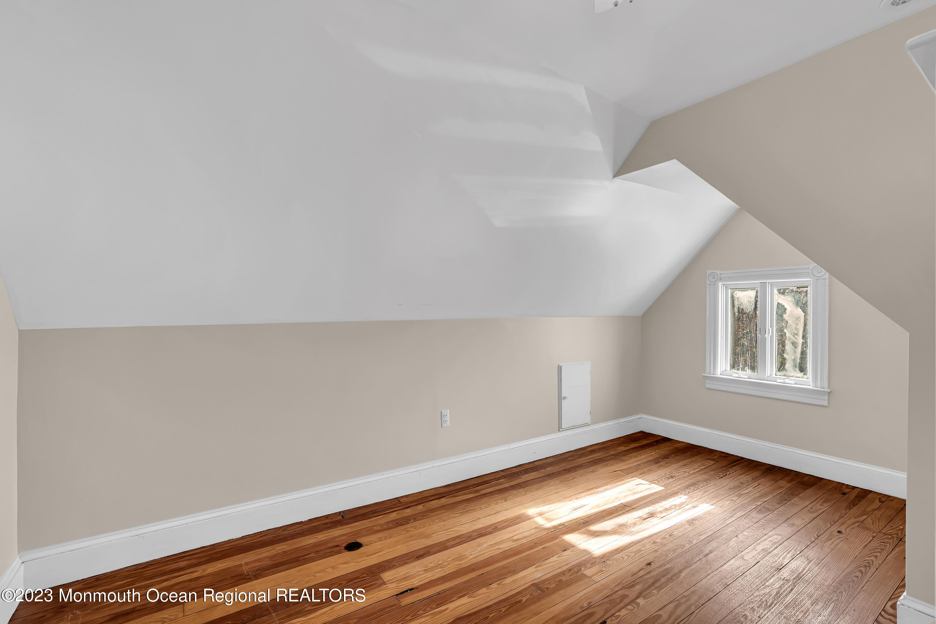 424 Mercer Avenue Spring Lake, NJ 07762 - Photo 29 of 36 an empty room with wooden floor and windows